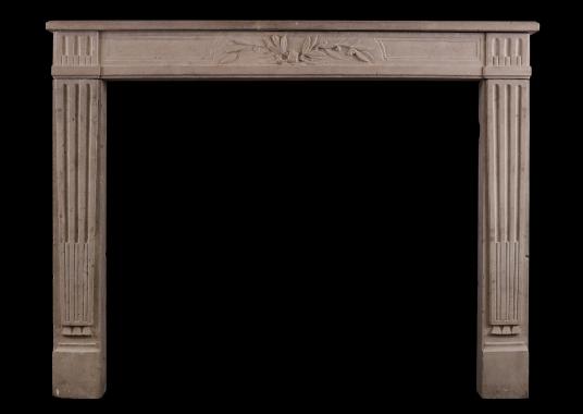 A Louis XVI style limestone antique fireplace