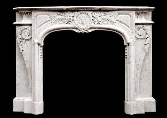 An attractive Louis XIV style Carrara marble chimneypiece