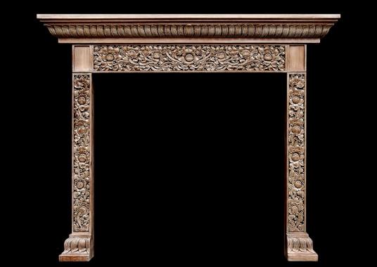 A heavily carved hardwood fireplace with an Oriental influence
