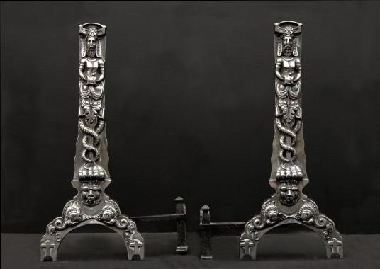 A pair of cast iron firedogs in the Baroque style