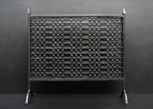A cast iron firescreen in the Gothic manner