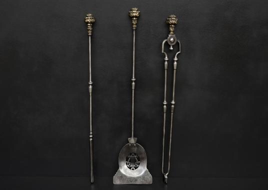 A set of brass and steel fire tools