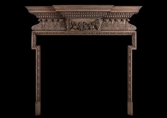 A carved pine fireplace