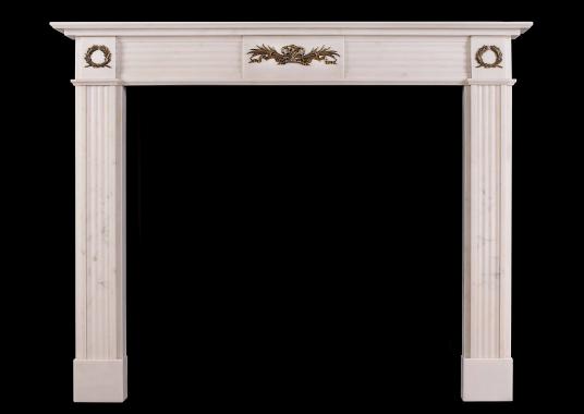 A Regency style Statuary marble fireplace with brass ormolu enrichments