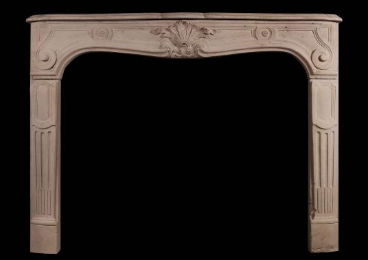 A French Louis XV antique stone fireplace