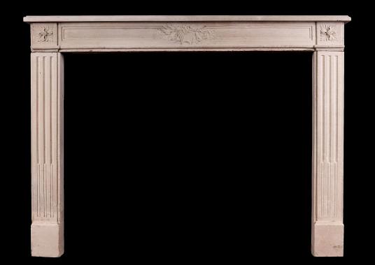 A French Louis XVI Style carved limestone fireplace