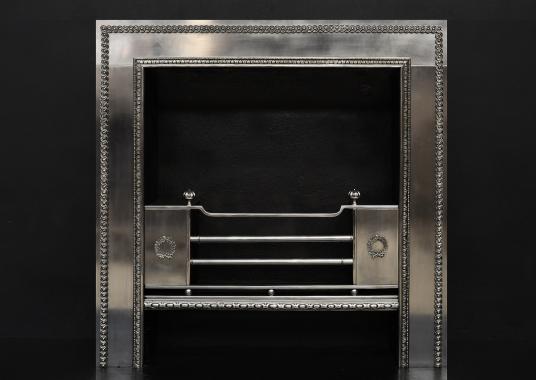 A polished steel Regency style register grate