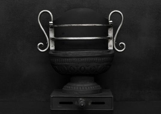 A Regency style cast iron urn grate