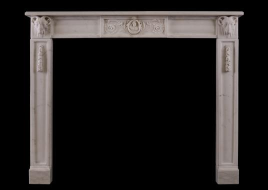 An Italian Statuario marble fireplace with carved rams heads