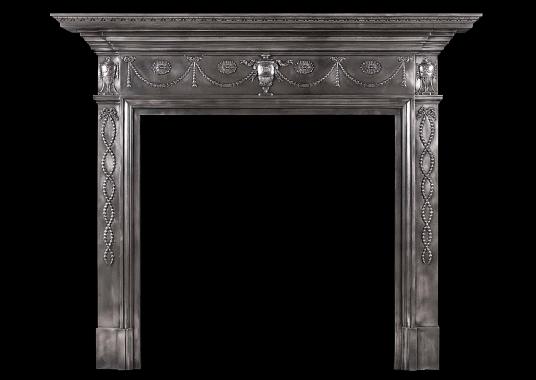 A 19th century polished cast iron fireplace in the Adam style
