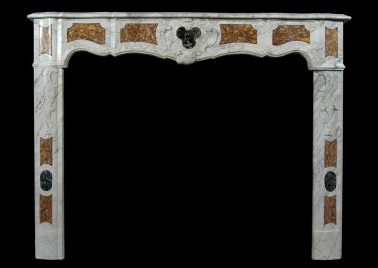 An 18th century French Provençal Carrara marble fireplace