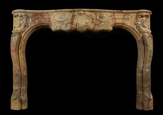 A superb quality French Louis XV style carved Sarrancolin marble fireplace