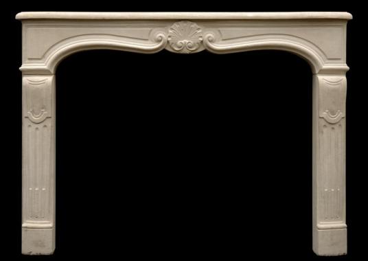 A 20th century Louis XV style limestone fireplace