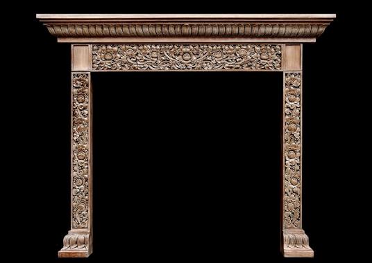 A heavily carved hardwood fireplace with an Oriental influence