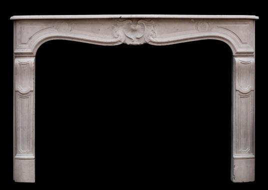 A 19th century French Louis XV style limestone fireplace