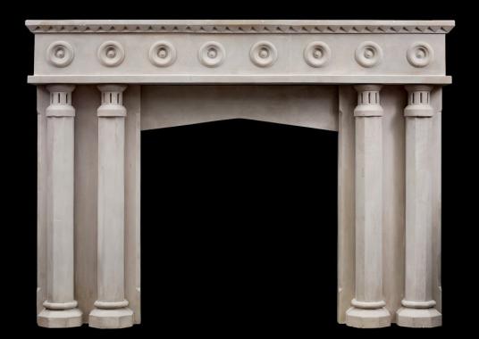 An English limestone fireplace with a gothic influence