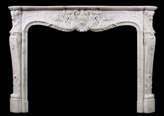 A fine quality carved French Louis XV Carrara fireplace