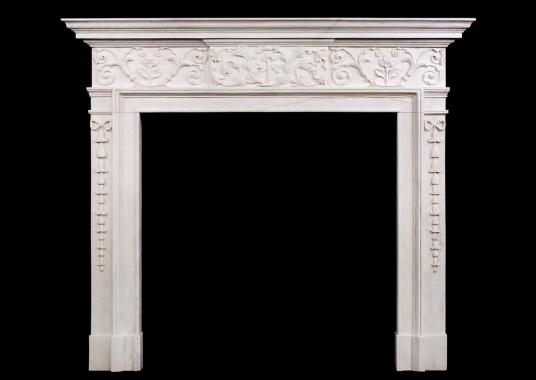 An attractive George III style white marble fireplace