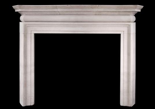 A large and imposing English Portland stone fireplace