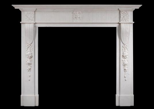 A Georgian style marble fireplace in white marble