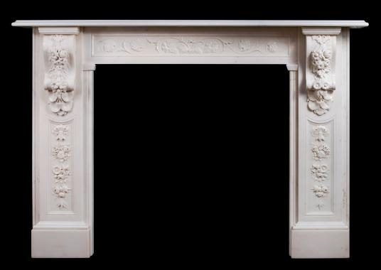 A well carved Victorian English Statuary marble fireplace