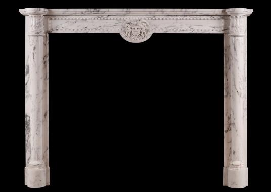 An antique French Louis XVI style fireplace in veined Statuary marble