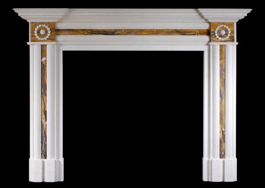 An English Regency style fireplace in white marble with Siena inlay