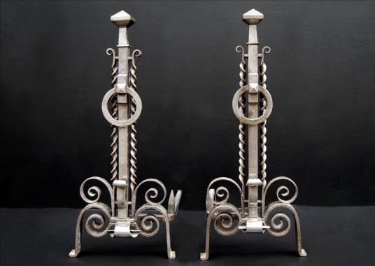 A pair of unusual 19th century english steel firedogs