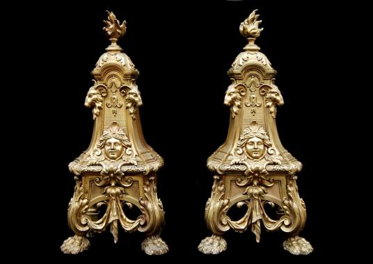 A pair of mid 19th century French brass andirons