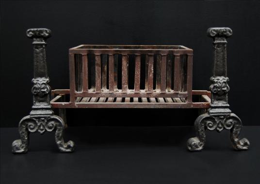 A large cast iron rectangular firebasket with vertical bars