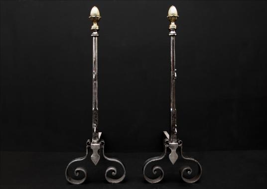 An elegant pair of english firedogs with brass acorn finials