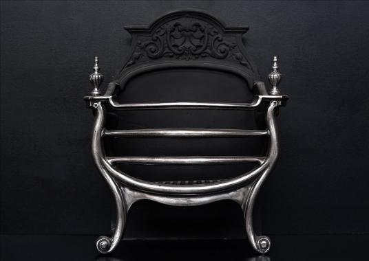 A late 19th century polished cast iron firebasket