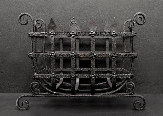 A rustic English wrought iron firegrate