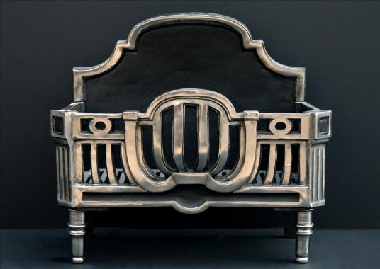 An Art Deco style polished steel firebasket