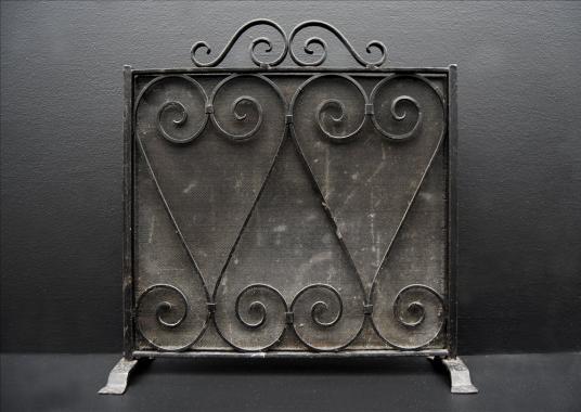 A small wrought iron firescreen