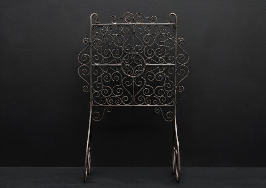 An attractive English wrought iron firescreen