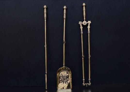 A set of late 19th century brass firetools 26 inch