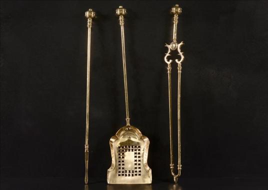 A set of late 19th century brass firetools