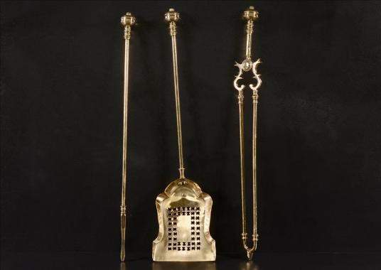 A set of late 19th century brass firetools