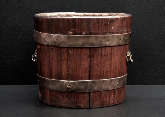 A rustic wood coal bucket