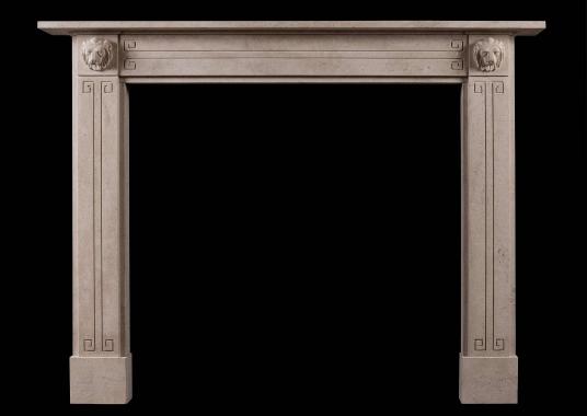 A Regency style Bath stone fireplace with carved lion's masks