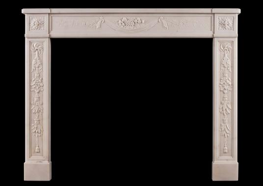 A finely carved French Louis XVI antique fireplace