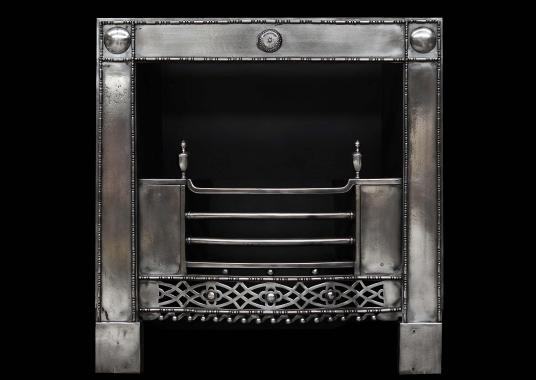 A Georgian style polished steel register grate