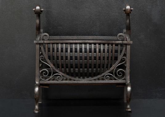 A late 19th century wrought iron firebasket