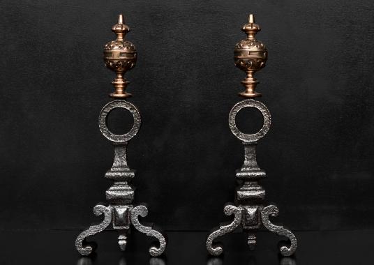 A pair of bronze and cast iron firedogs in the Baroque style
