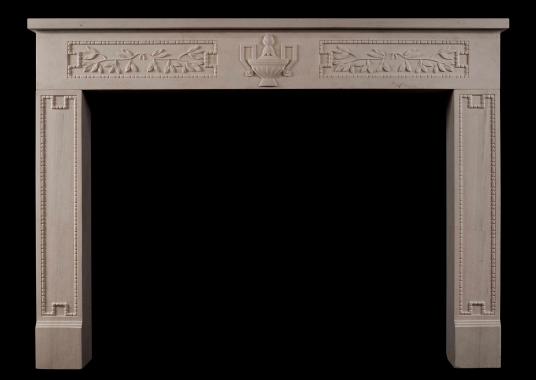 A rustic French limestone fireplace in the Louis XVI style