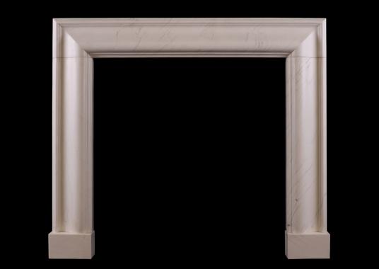 A white marble bolection fireplace