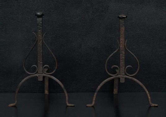 A set of wrought iron firedogs