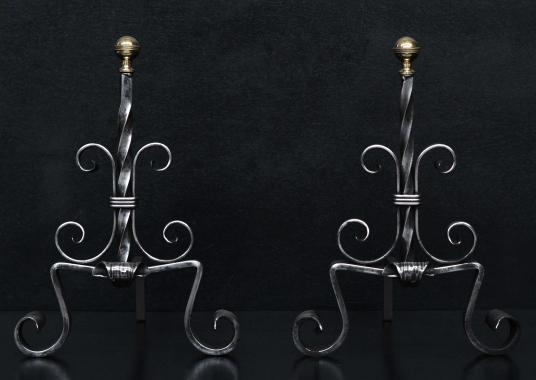 A pair of polished steel French firedogs