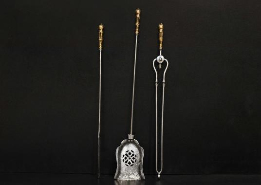 A set of 19th century steel and brass firetools